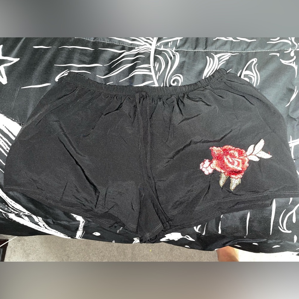 Black shorts with rose